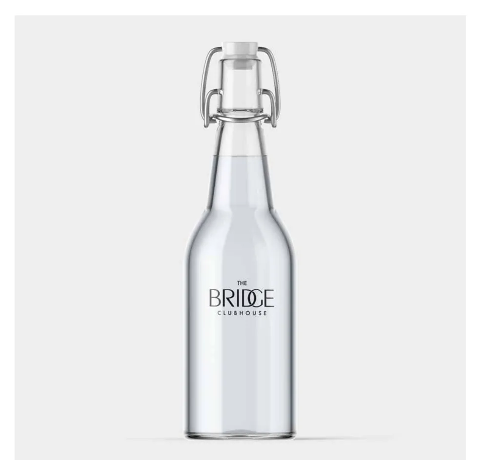 Glass water bottle, branded with The Bridge Clubhouse identity